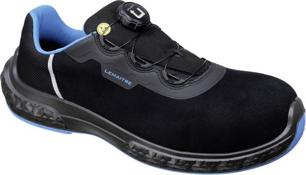 The image shows a black safety shoe with blue accents. It features a laceless design with a twist lock for adjustment and a sturdy, non-slip sole.