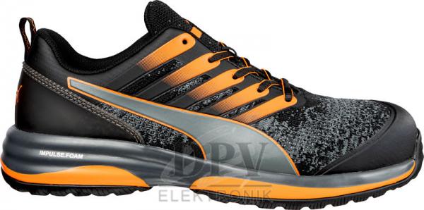 The shoe is sporty and comfortable, in black with orange accents. It has a textured surface and a grippy sole for good traction. The laces are visible.