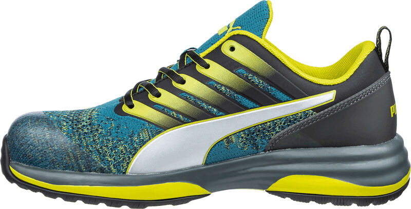 The shoe is a sporty sneaker with a green and blue upper. It has black laces, a silver sideline, and a thick, gray sole with yellow accents.