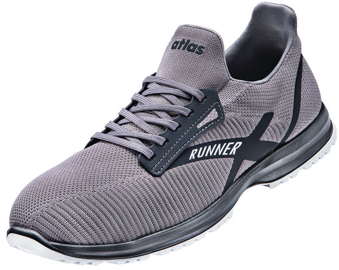 The shoe is a light, gray sneaker with an elastic, breathable upper. It has gray laces and a black sole with a prominent "RUNNER" inscription.