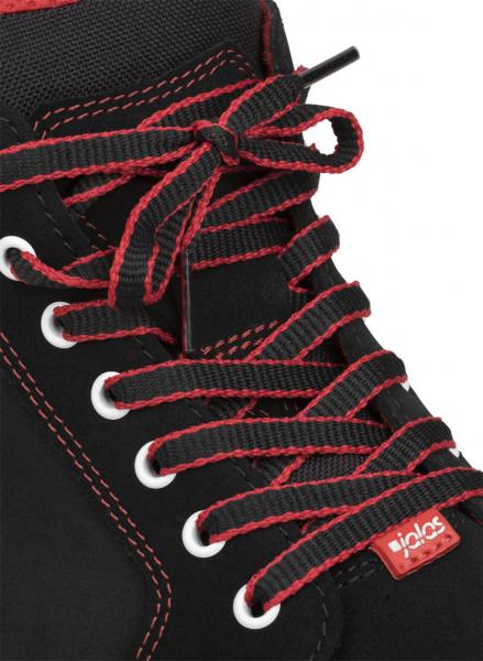 The image shows a black shoe with red laces. The laces are intricately tied and run through white eyelets. A small red patch is visible.