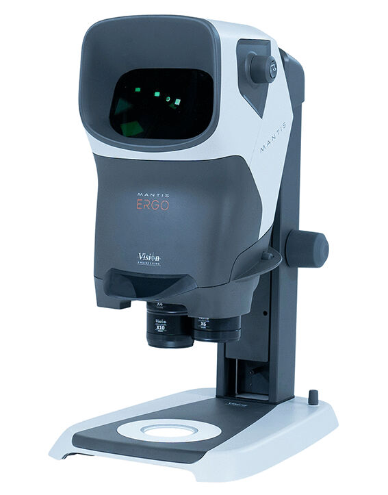 The image shows a microscope with a compact, modern design. It has a large, rounded head and a stable base, which incorporates a round platform for sample placement.