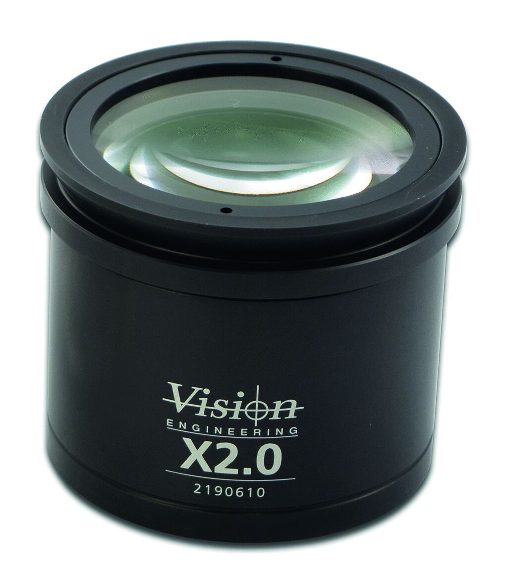 The image shows a round, black lens with a smooth, transparent lens in the center. It reads "Vision Engineering X2.0". It has a sturdy, cylindrical shape.