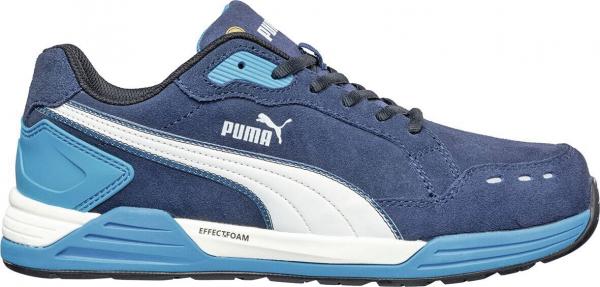 The shoe is a sporty sneaker in dark blue with light blue accents. The sole is lightweight and offers good grip. On the side, the Puma logo is visible.