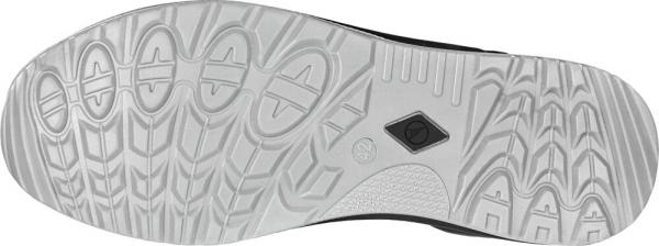 The image shows the sole of a sports shoe. It is predominantly white with a textured surface featuring various patterns that provide good traction.