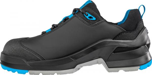 The shoe is sporty and flat, primarily black with blue accents. It has a sturdy sole and a sleek silhouette, ideal for outdoor activities. The shoe appears stable and functional.