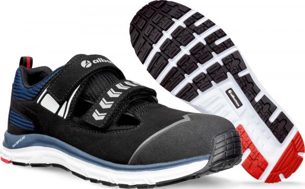 The image shows a sporty shoe in black with blue accents. It has a wide, padded strap and a grippy, textured sole in white and red.