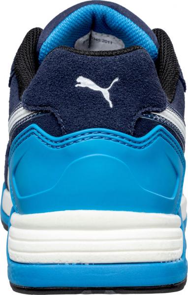 The image shows the rear view of a sports shoe. It is predominantly dark blue with a light blue heel area. The Puma logo in white is visible on the upper side.