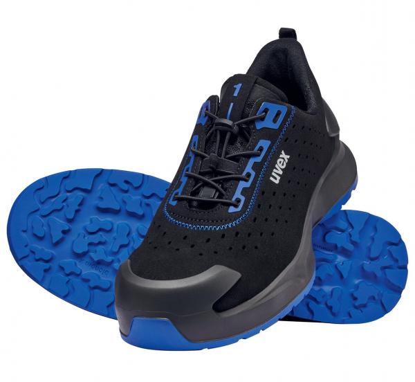 The image shows a black sports shoe with blue accents. The shoelaces are also blue, and the sole has a grippy, textured pattern. The shoe looks sporty and modern.