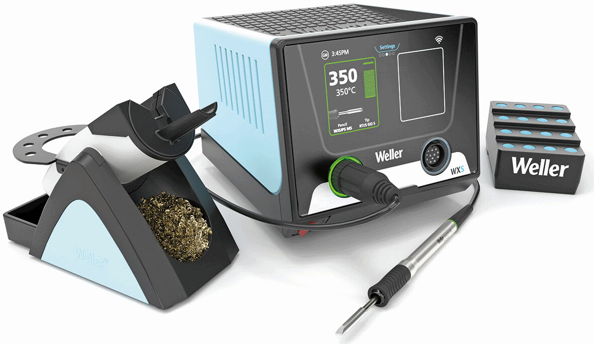 The image displays a soldering station with a digital display. Next to the station, there is a soldering tip holder and three soldering tips. The predominant colors are blue and black.