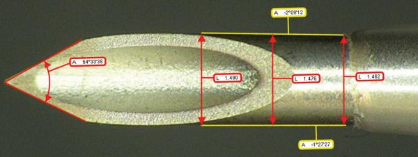 The image shows the tip of a metallic tool. There are several measurement lines with numbers indicating various distances and lengths. The contours are precise and appear technical.