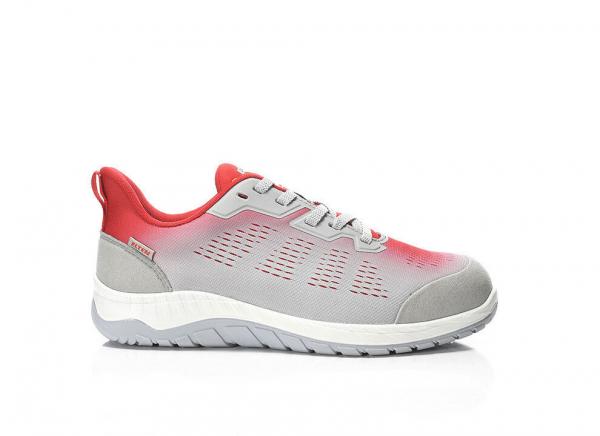 The shoe is a sporty sneaker with a gray surface and red accents. It has a lightweight, flexible sole and a breathable structure. The laces are gray.