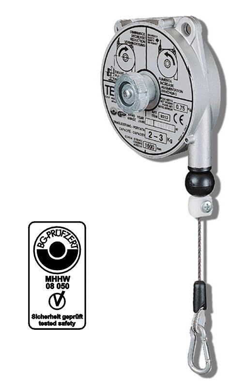 The image shows a metal dispenser with a round, flat back, a central shaft, and a retractable wire rope. Next to it, a safety label is depicted.