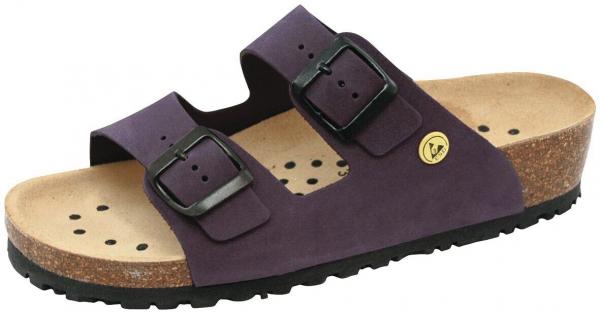 The image shows a purple sandal with two adjustable straps and buckles. The sole is made of brown cork and has small ventilation holes. The underside is black and textured.