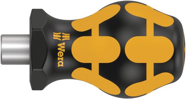 The image shows a black, elliptical handle with yellow, rubber-like patterns. It has a metallic connector on one side, likely for tools.