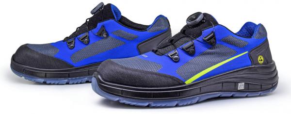 There are two athletic shoes in blue and black visible. They have a flexible sole, reinforced toes, and a laceless closure technique with a twist mechanism.