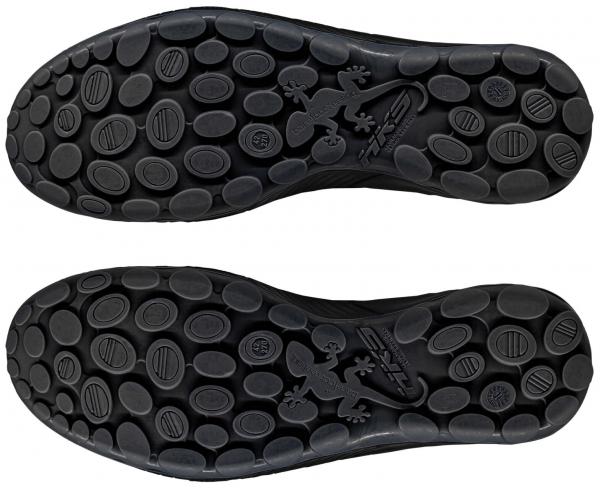 The image shows two black shoe soles with many small, round protrusions. The soles are symmetrically arranged and feature a continuous, flexible design.