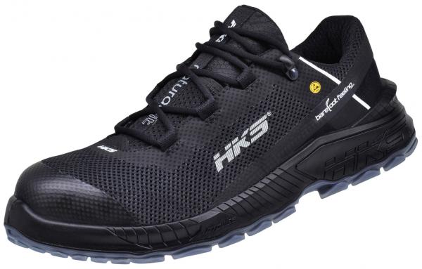 The shoe is a lightweight, athletic-style sneaker in black. It features a breathable, textured upper and a grippy, flexible sole. Ideal for athletic activities.