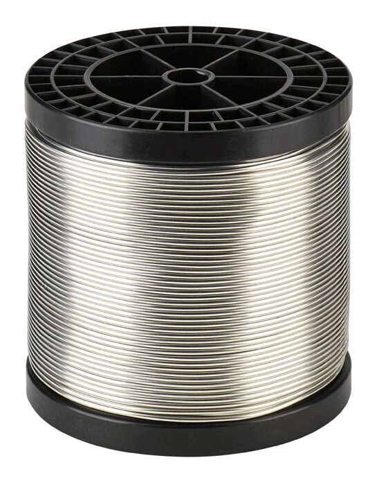 The image shows a round coil made of black plastic, with shiny, thin wire windings on it. The coil has a flat top with a grid pattern.