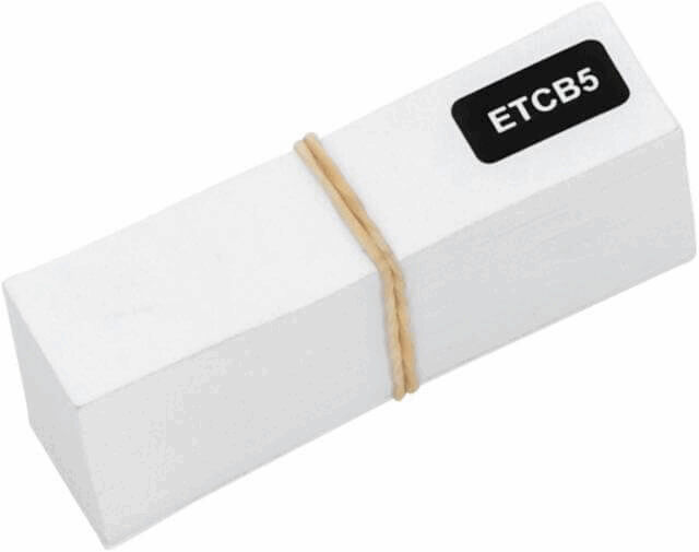 The image shows a rectangular, white block held together by a rubber band. On the top, there is a black label with the inscription "ETCB5".