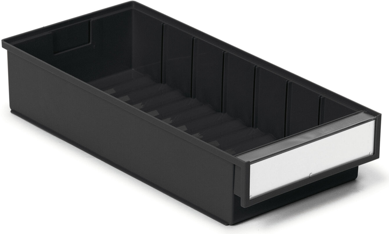 The image shows an elongated, rectangular drawer in black, with a perforated bottom. A white, writable front panel is attached on one side.