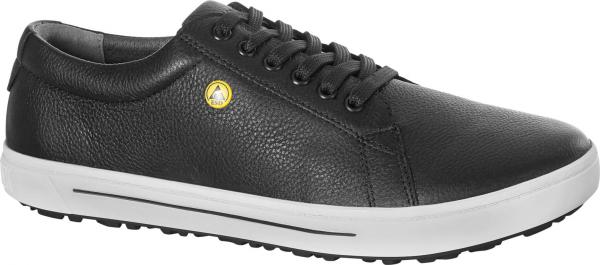 The shoe is low-cut, made of black leather with a textured surface. It has white rubber on the sole and five eyelets for laces. A yellow logo is located on the side.