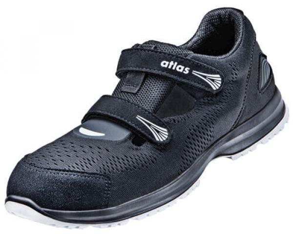 The shoe is black, sporty, and has two Velcro straps. The surface is perforated with small holes that provide air circulation. The sole is light and flexible.