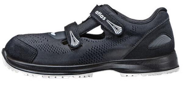 The shoe is black with a smooth, flexible sole and a padded interior. It has two adjustable Velcro straps and a breathable upper with holes.