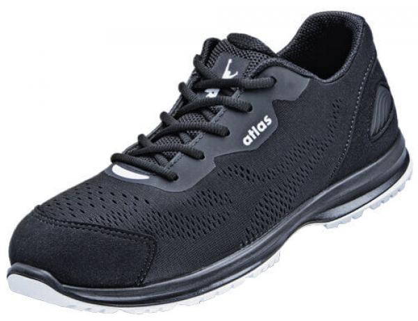 The shoe is black with a breezy, breathable upper. It has a flat sole and is closed with laces. On the side is the logo "atlas".