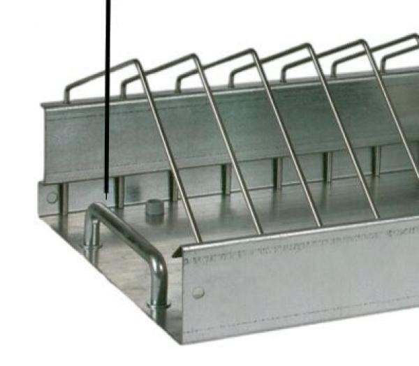 The image shows a metallic holding device with several angled metal bars. There is a rounded edge at the bottom and a small round elevation in the center.