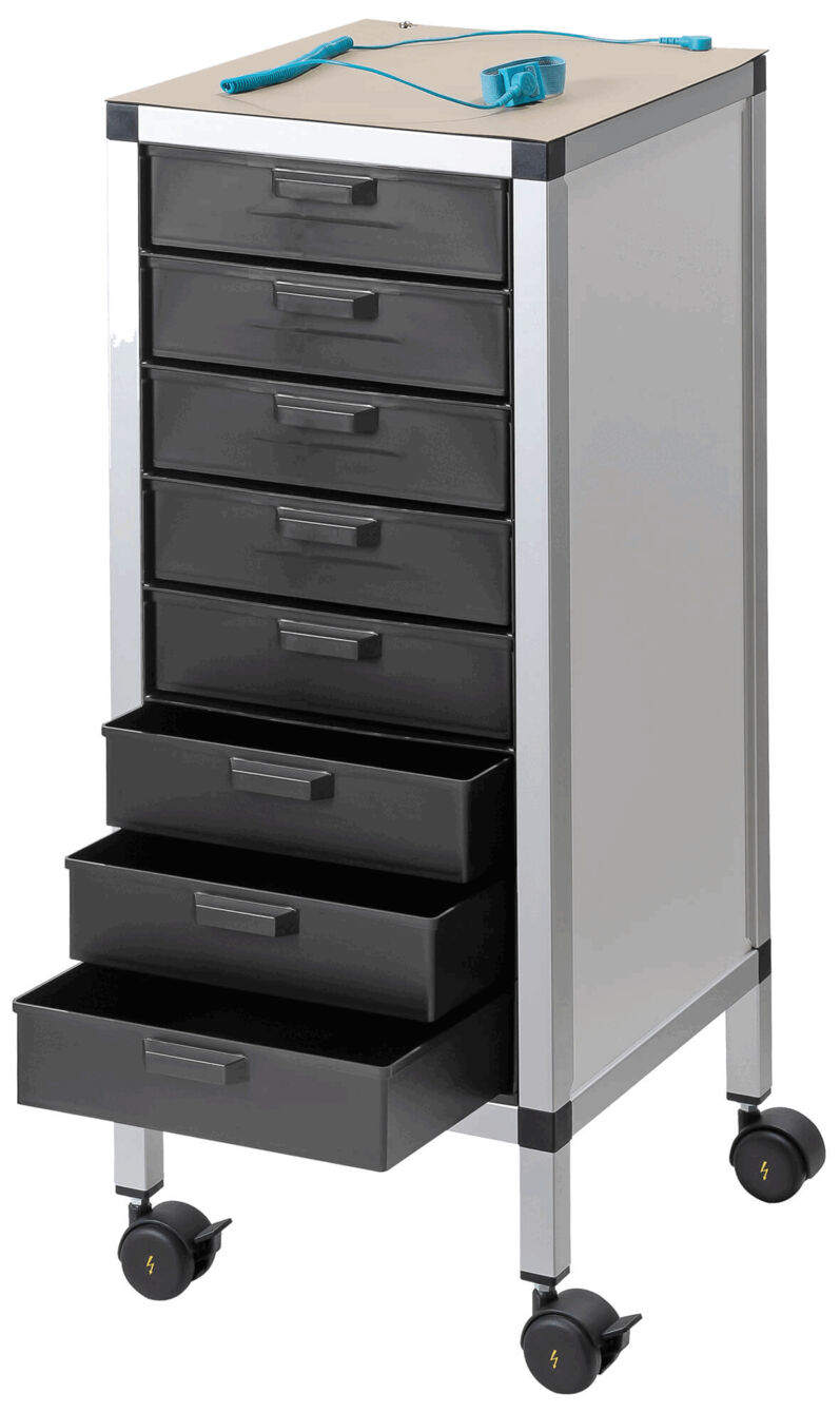 The image shows a mobile cart with seven black drawers. On top, there is a flat surface with a blue pen and a ruler on it. The cart has wheels.