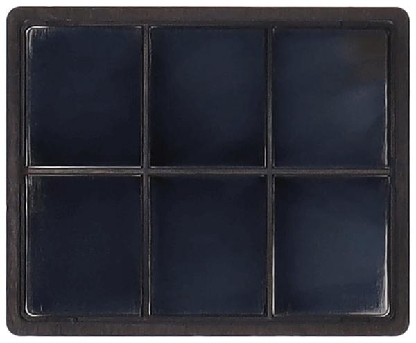 The image displays a rectangular palette with six equally sized, rectangular compartments. The compartments are black and feature a smooth, glossy surface. The frame is also dark.