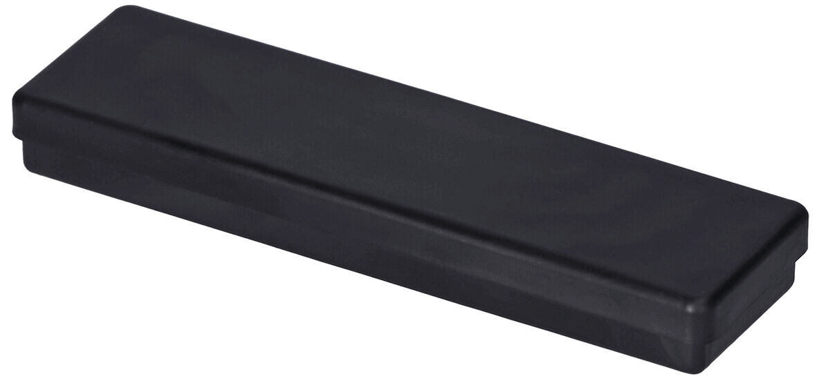 The image shows a rectangular, flat container in black. It has rounded edges and a smooth surface. The lid appears to close seamlessly.