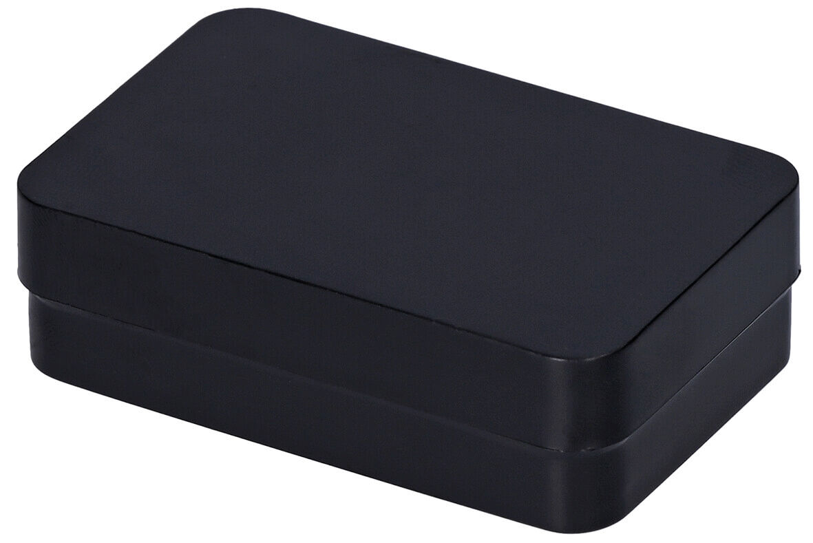 The image shows a rectangular, matte black box with rounded edges. It has a flat lid and appears simple and modern. The surface is uniform and without any patterns.