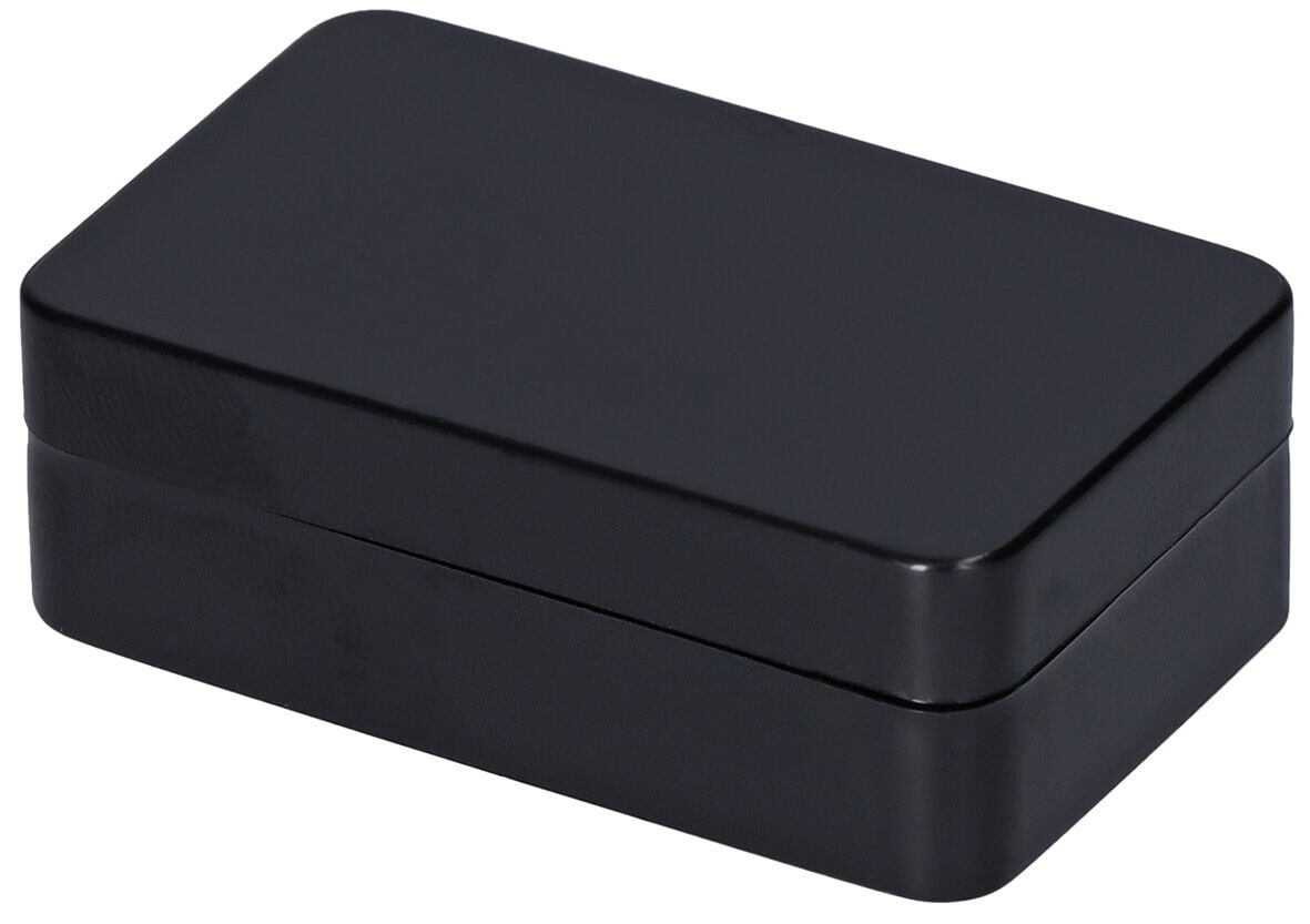 The image shows a rectangular, black box with smooth surfaces and rounded corners. It has a lid that fits onto the bottom. The box looks elegant and simple.