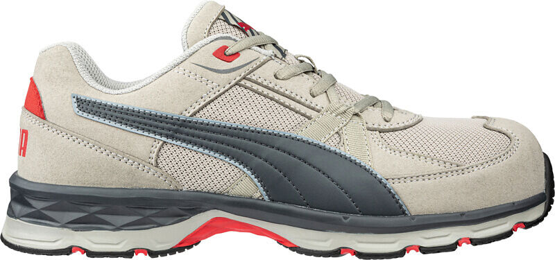 The shoe is a sporty sneaker in beige with gray and red accents. It has a thick sole, laces, and breathable textile upper.