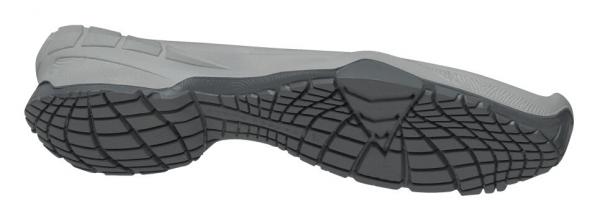 The image displays the sole view of a sports shoe. The sole is predominantly gray with a textured, non-slip tread that ensures good grip.