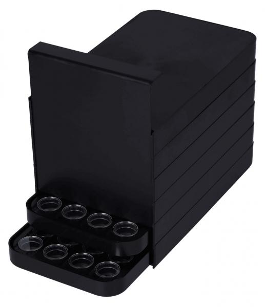 It is a black, rectangular box with several round openings on the front. The box has a vertical, flat back and seems to be intended for storing small items.