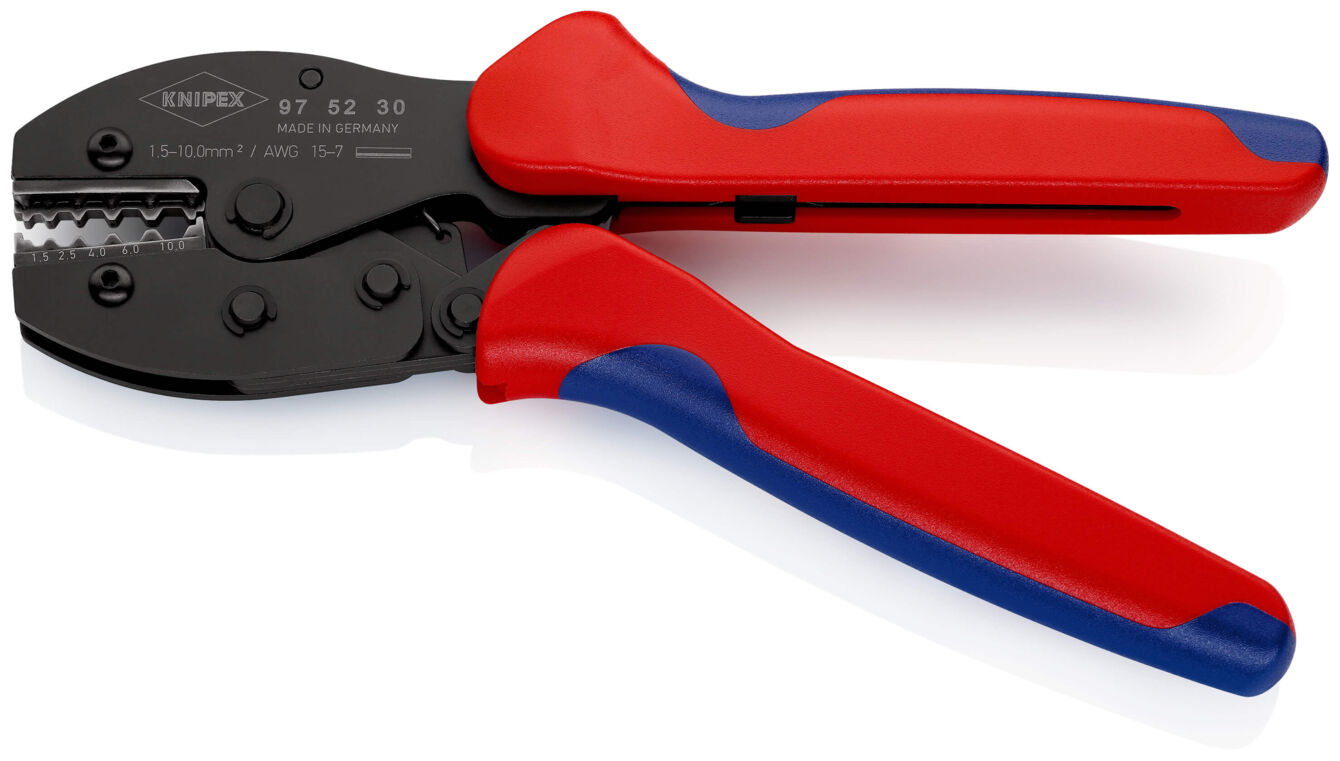 The image shows a crimping tool with black blades and red, ergonomic handles. It has a special structure to connect or crimp cables.