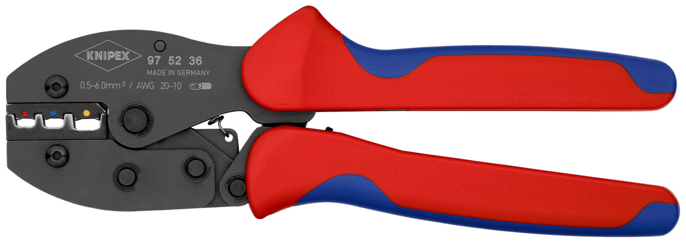 The image shows a crimping tool with red and blue handles. The tool has a black working surface with various slots for cables. It is ergonomically designed.