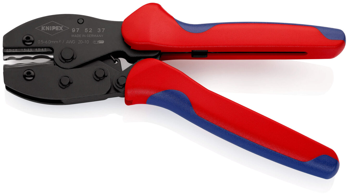 The image shows a crimping tool with black, metallic jaws and red, ergonomic plastic handles. The pliers are clippable and have a serrated area for securing cables.