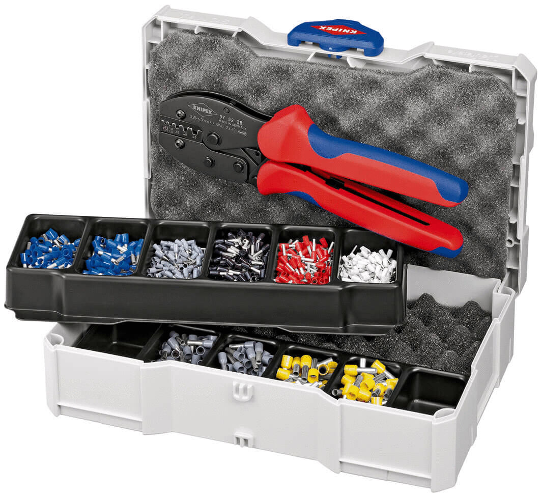 The image shows a blue and gray toolbox. Inside, there is a pair of pliers with red and blue handles, as well as several compartments with various terminals in different colors.