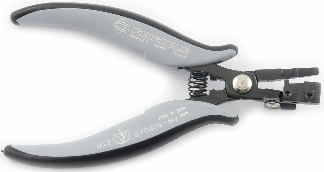 The image shows a tool similar to pliers with gray, rubberized handles and a black, metal head. The head has a special shape with a compression spring.