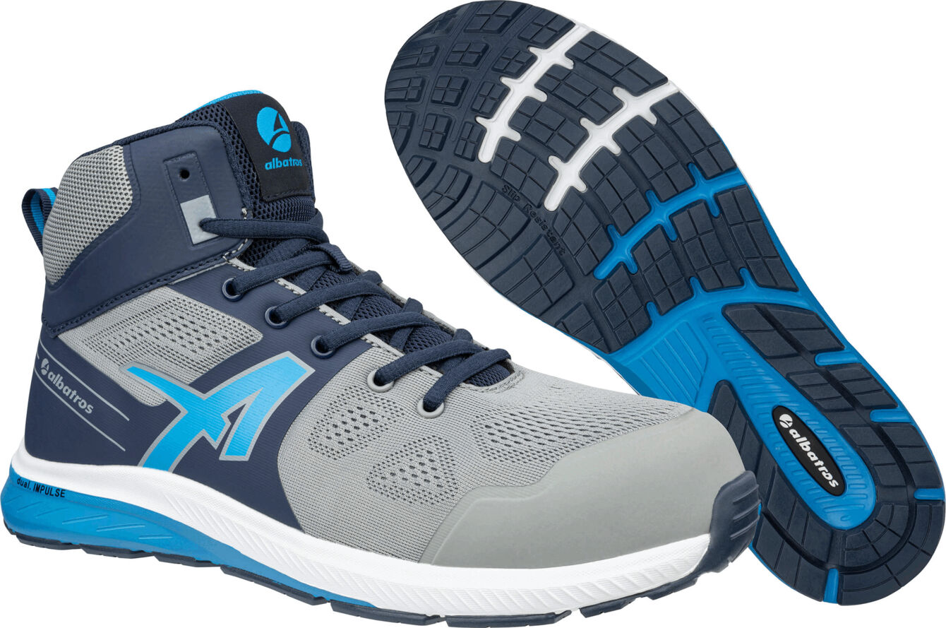 The image shows a gray-blue sports shoe with a high upper. It has a textured-looking surface and a non-slip sole with blue detail. The shoe appears sporty and modern.