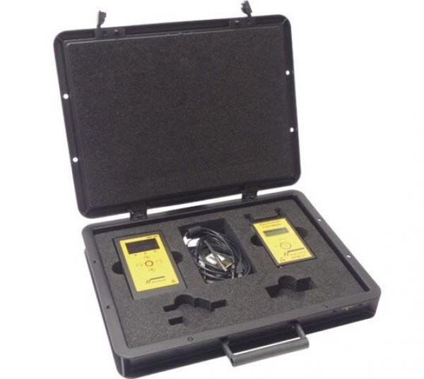 The image shows a black suitcase that is open. Inside, there are two yellow devices and a cable, surrounded by foam padding for protection and support.