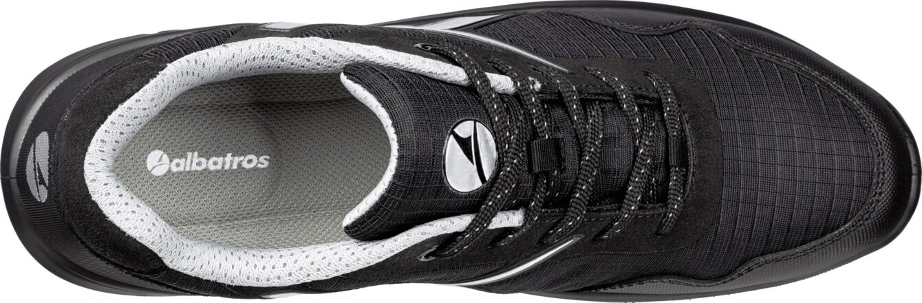 The shoe is black with a textured surface. It has a round shape, a padded insole, and flat, black laces. The brand "albatros" is visible.