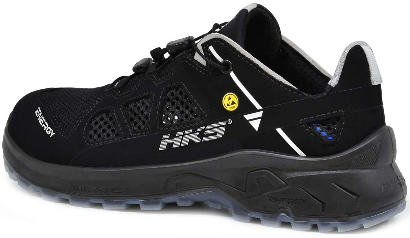 The image shows a black athletic shoe with a flat profile. It features a breathable upper with small holes and a sturdy, non-slip sole. The design is modern and sporty.