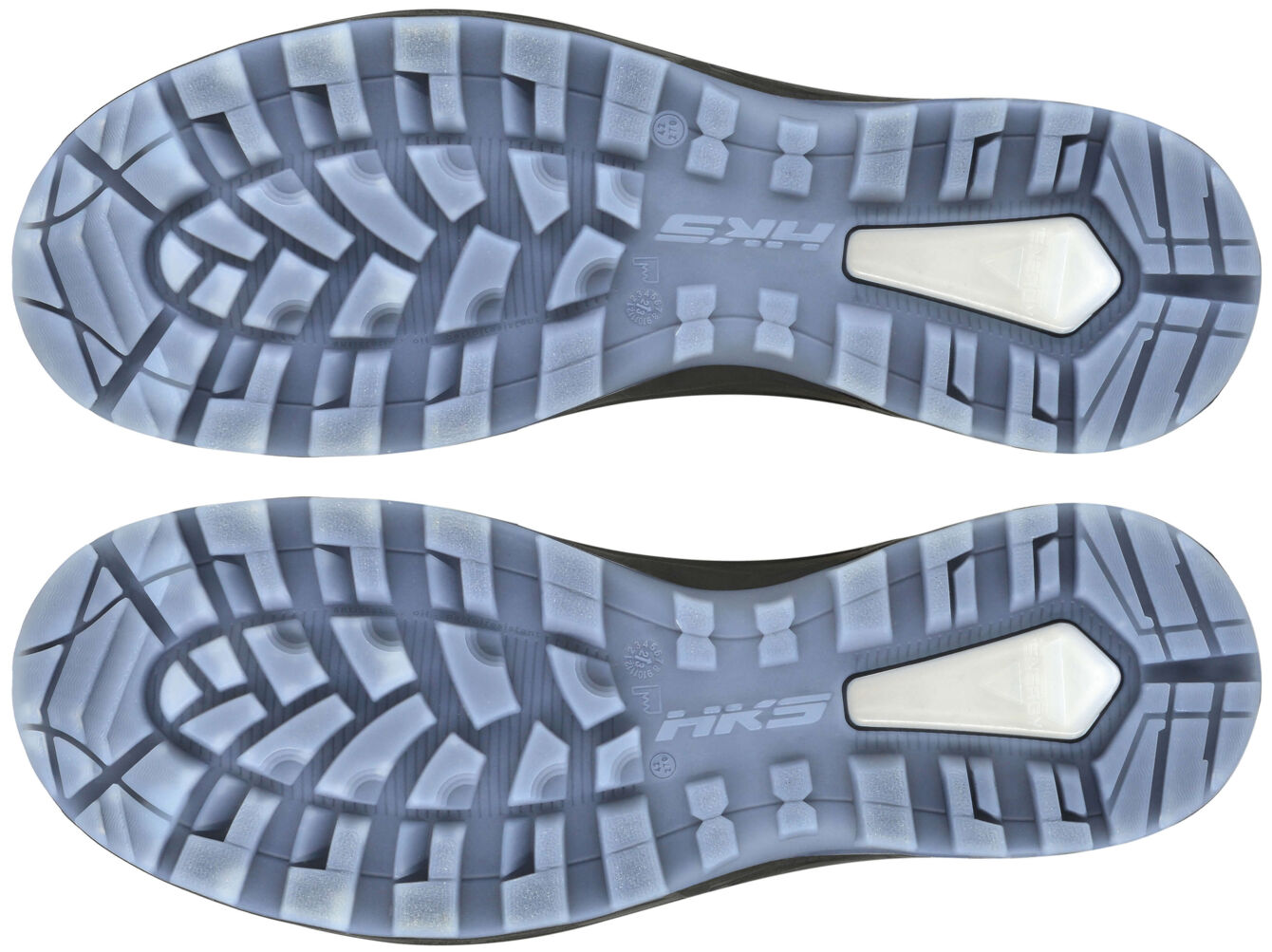 The image shows two shoe soles lying parallel to each other. The sole has a textured tread with vertical and horizontal grooves and a white area on the side.