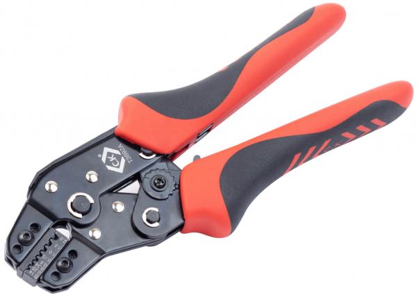 The image shows a large, black wire cutter with red rubber handles. The handles are ergonomically shaped, and the cutting area has various openings for stripping wires.