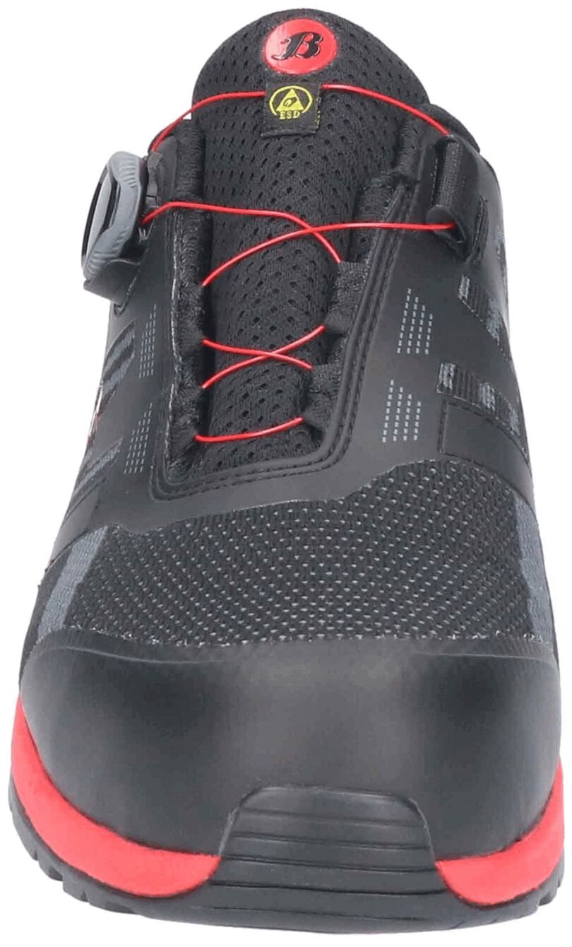 The image shows a sporty, black shoe with red accents. It features a modern design, mesh-like materials, and a quick-lacing system. The sole is stable and grippy.